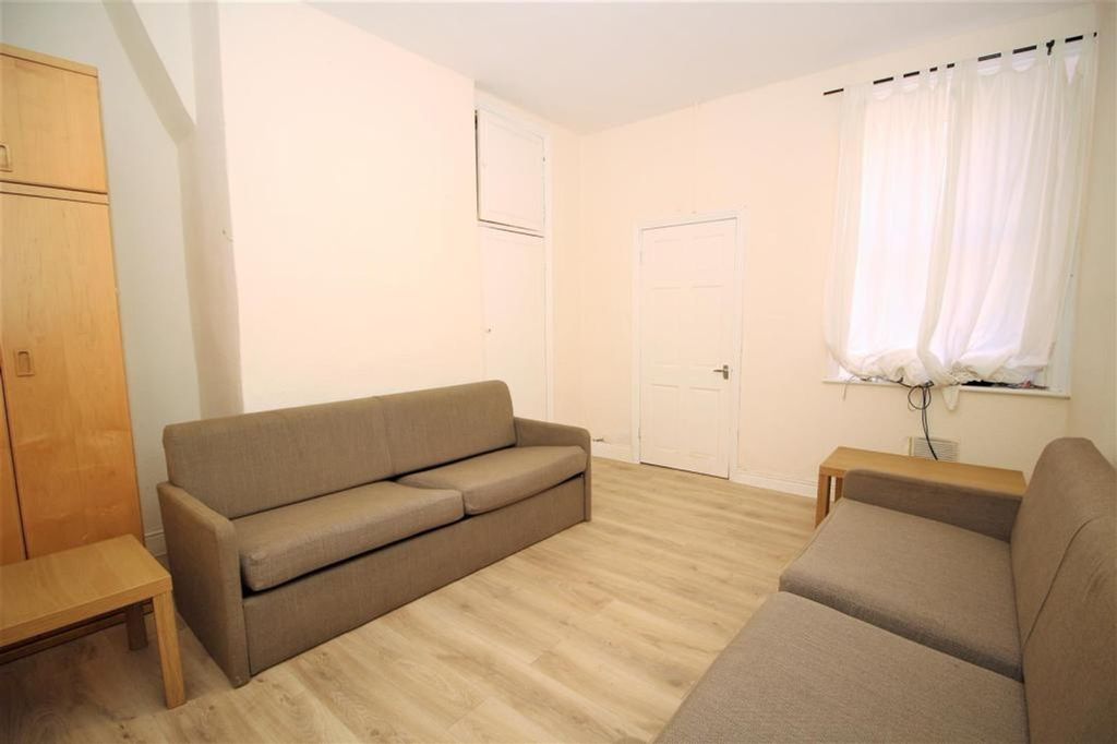Property photo 1 of 5 A Cozy Living Room Featuring Comfortable Seating A...