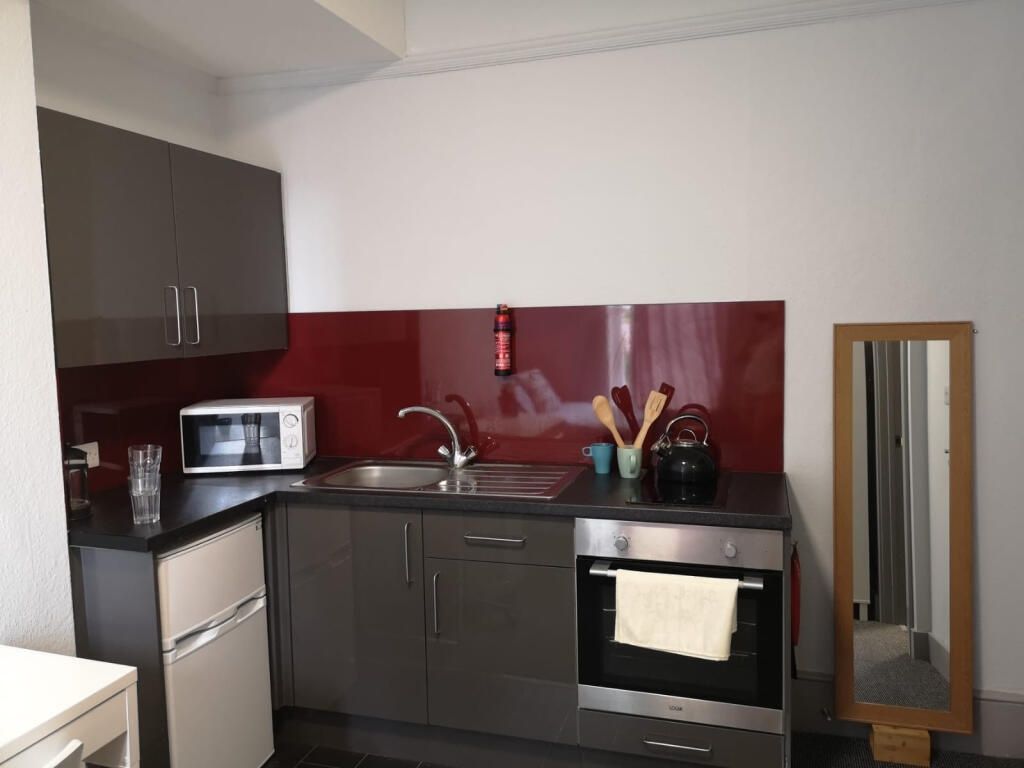 Property photo 2 of 5 Modern Kitchenette With Sleek Grey Cabinets...