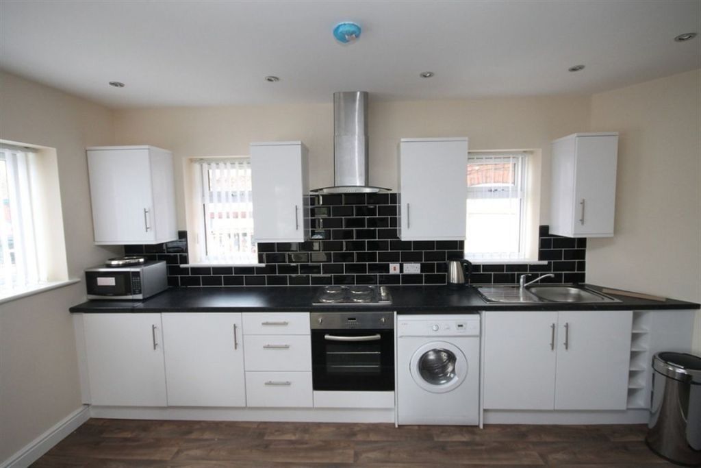 Property photo 1 of 12 Modern Fitted Kitchen With White Cabinetry, Black ...