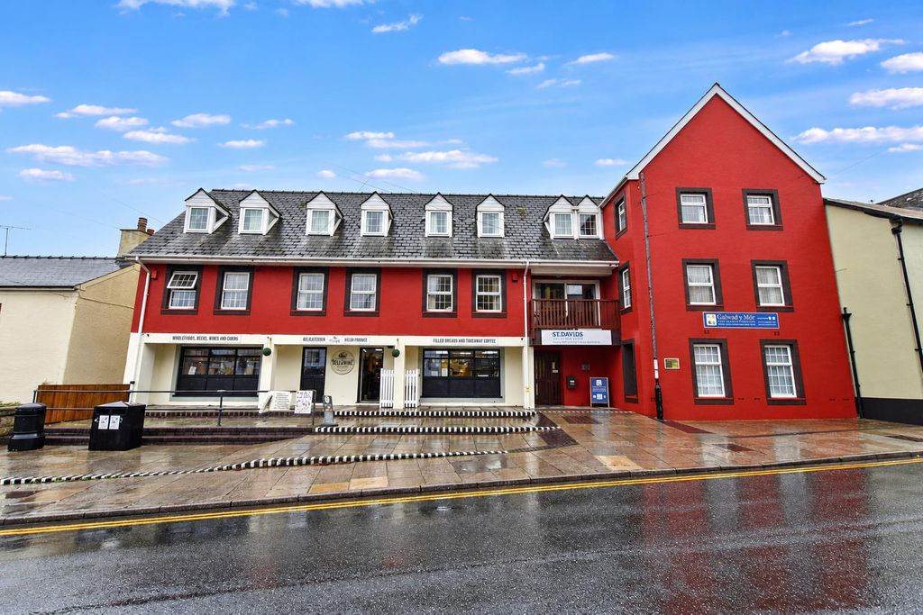 Property photo 1 of 30 Rainy Street View Of Coastal Delicatessen Building