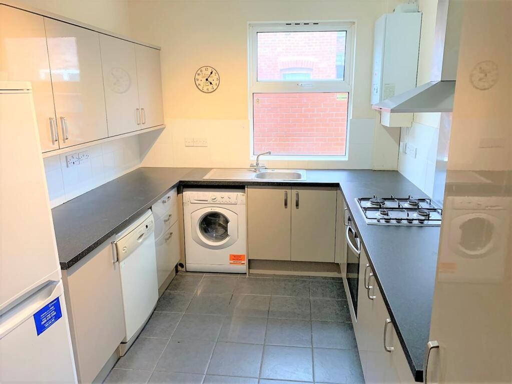 Property photo 3 of 12 This Well-Appointed Kitchen Features Modern Applia...