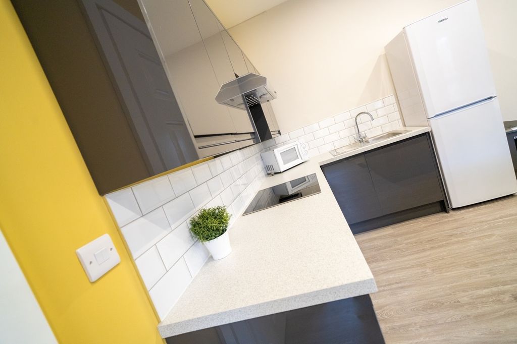 Property photo 2 of 8 Modern Kitchen With Ample Workspace, Sleek Cabinet...