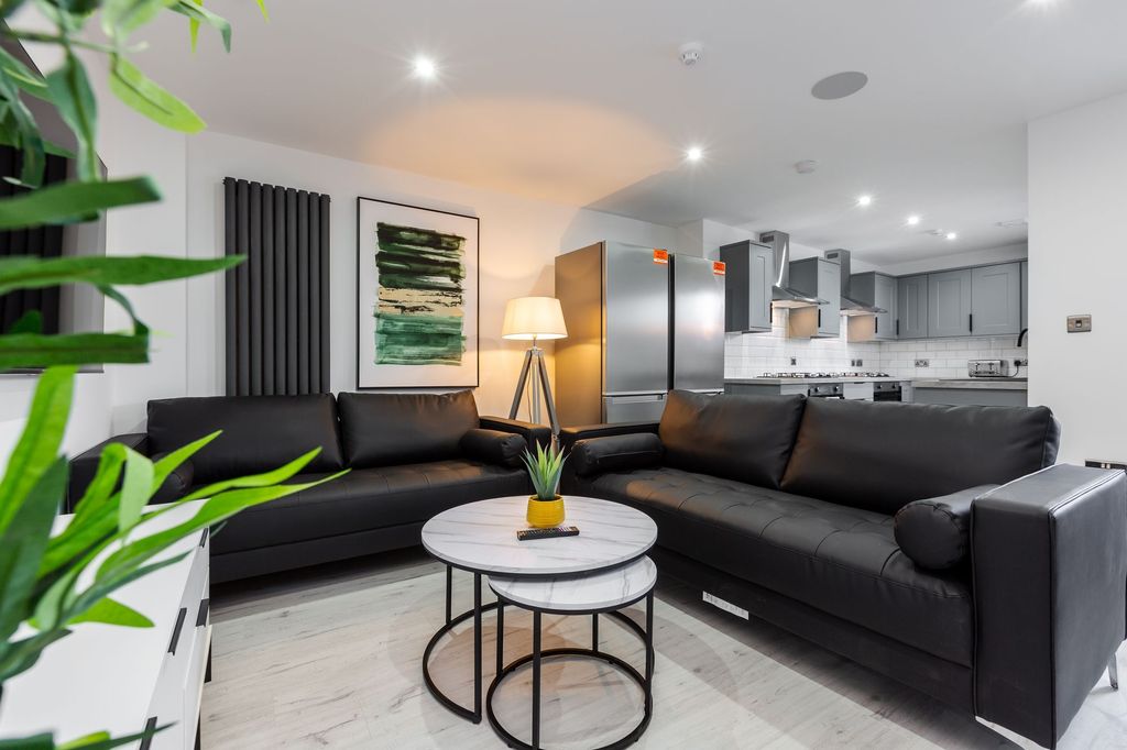 Property photo 2 of 7 Modern And Stylish Living Room Featuring Two Spaci...