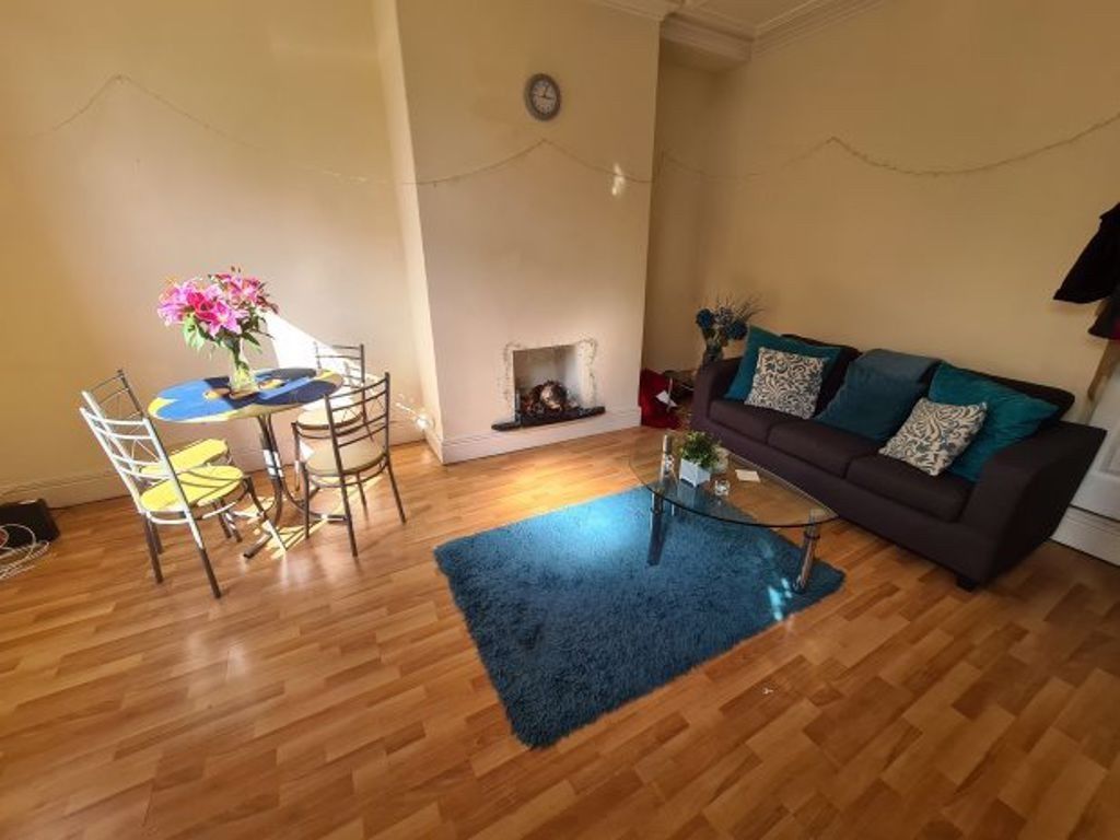 Property photo 2 of 10 A Bright And Welcoming Living Room Featuring A Com...