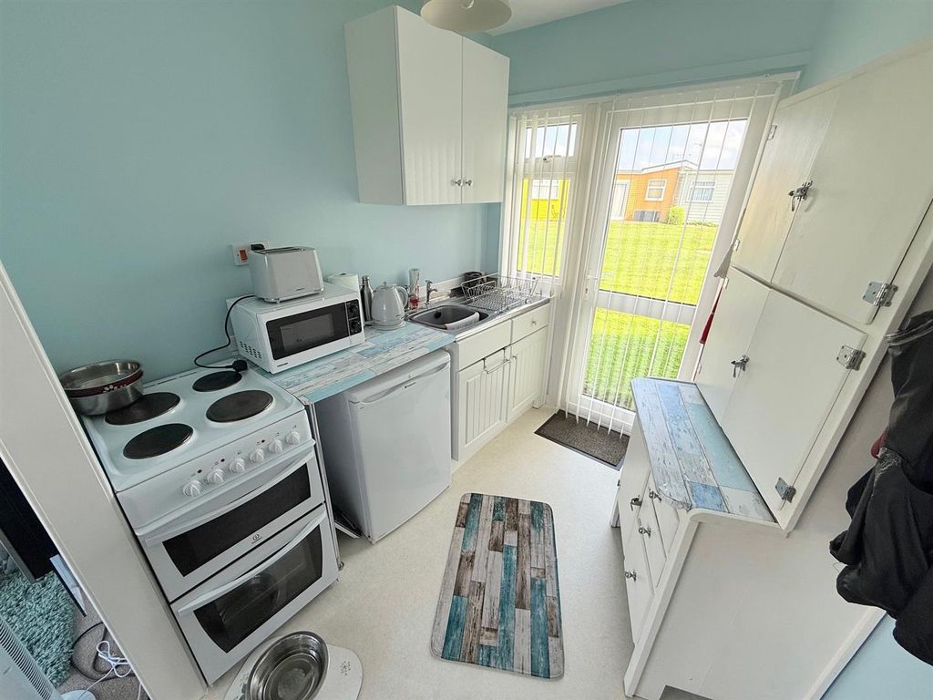 Property photo 3 of 9 Kitchen Area