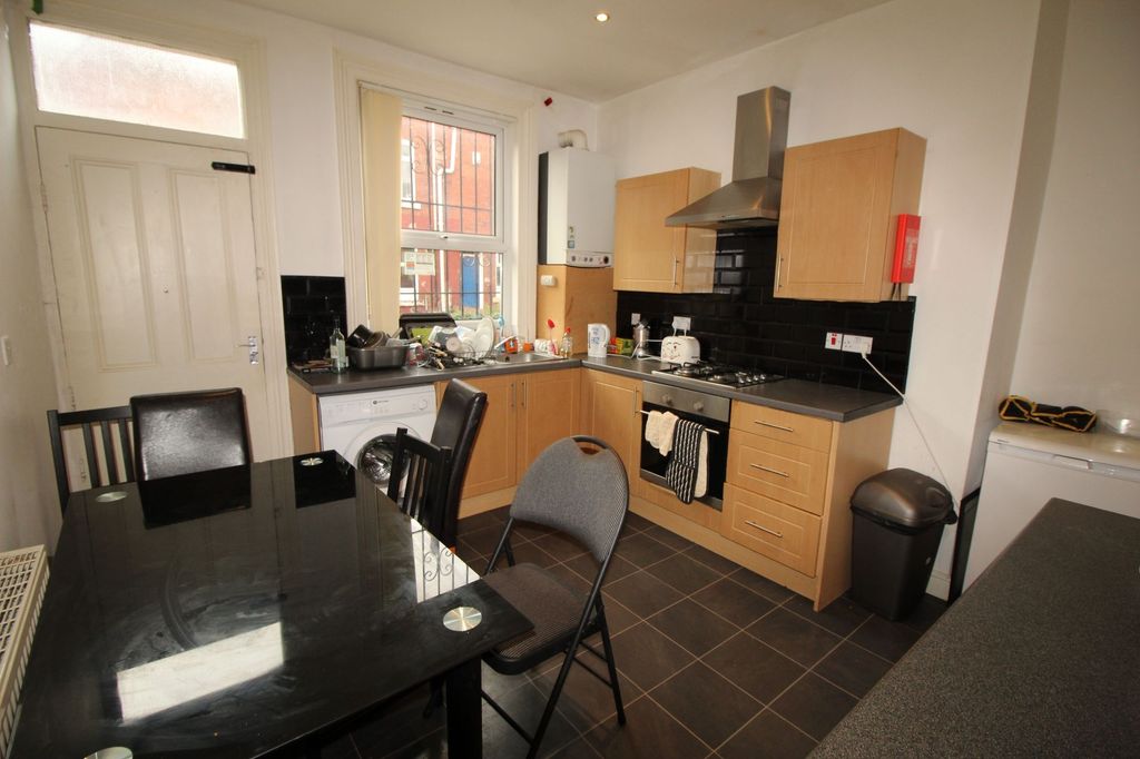 Property photo 3 of 6 Bright And Functional Kitchen Featuring Modern Lig...