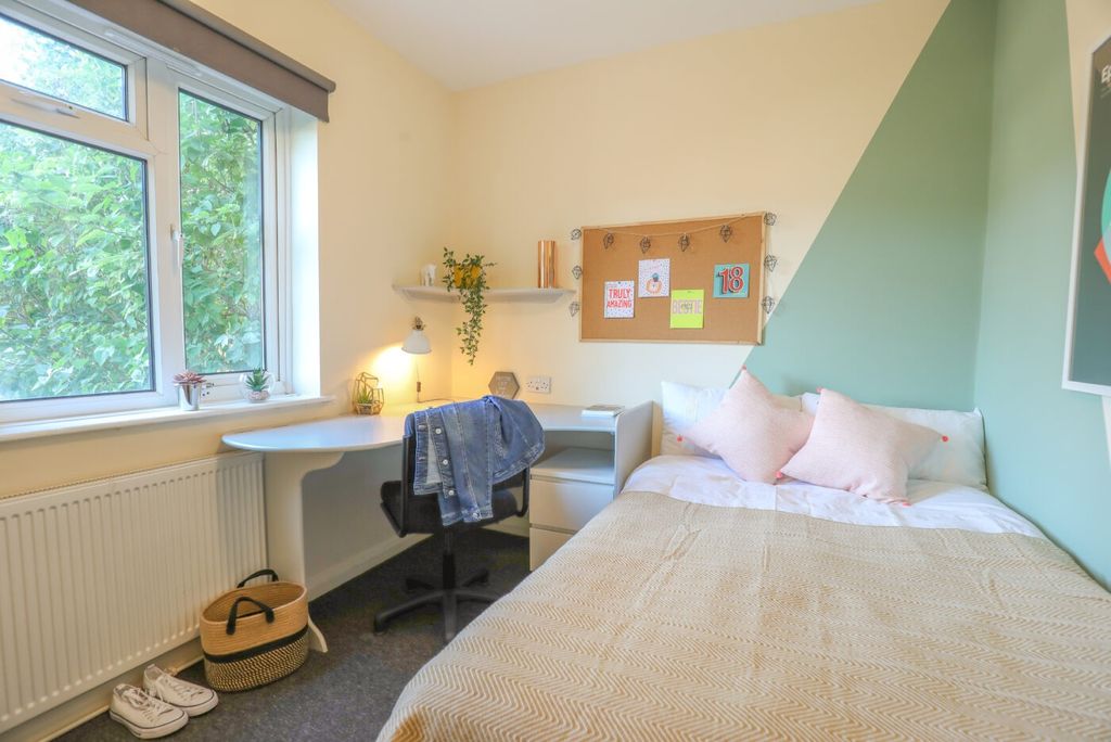 Property photo 3 of 7 Bright And Inviting Bedroom With Ample Natural Lig...