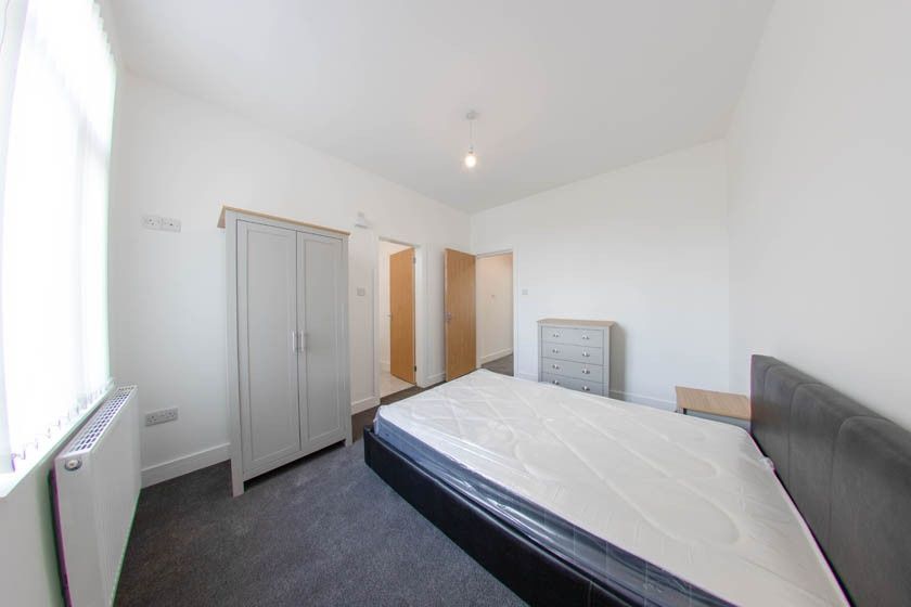 Property photo 3 of 17 A Spacious, Well-Lit Master Bedroom Featuring A La...