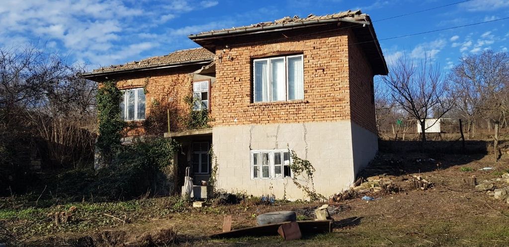 Property photo 2 of 49 Side Perspective Of A Two-Storey Rural House Showing Brick Walls, White Framed Windows, And A Tiled Roof.