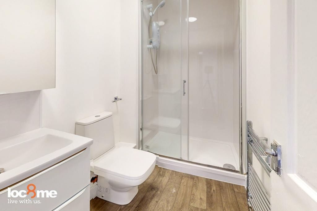 Property photo 3 of 13 A Modern And Clean Bathroom Featuring A Sleek Show...