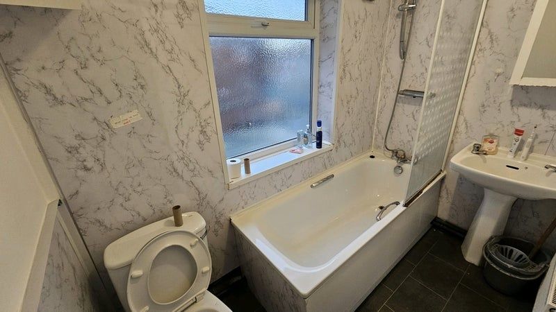 Property photo 2 of 10 Bright And Clean Bathroom Featuring A Full-Sized B...