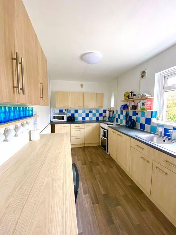 Property photo 3 of 3 This Well-Appointed Kitchen Features Modern Cabine...