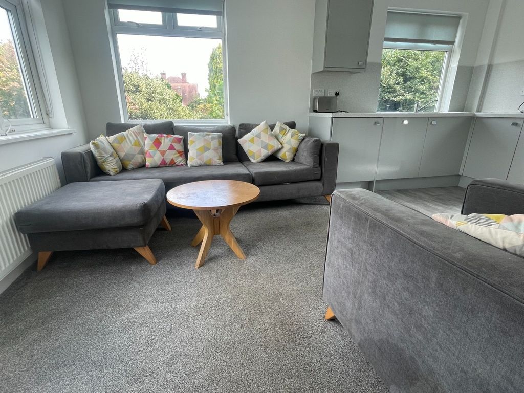 Property photo 2 of 13 This Inviting Living Room Features Ample Seating W...