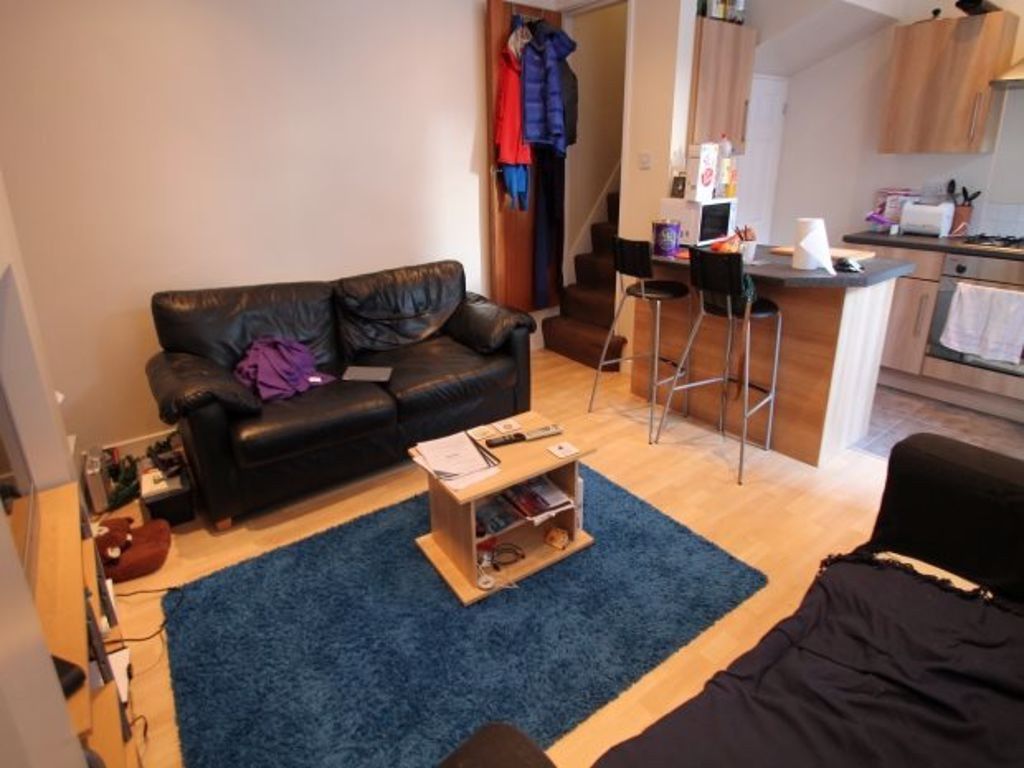 Property photo 1 of 7 Bright And Cozy Living Room Featuring Comfortable ...
