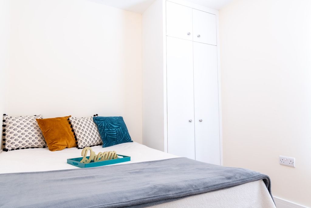 Property photo 3 of 15 Cozy Double Bedroom Featuring A Comfortable Bed Wi...
