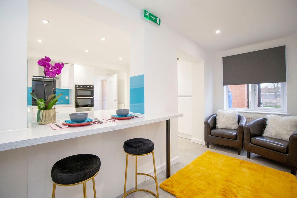 Property photo 1 of 26 A Clean And Modern Living Room With Stylish Furnit...