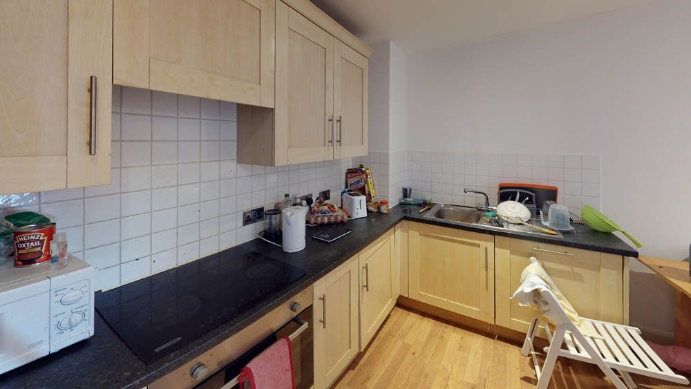 Property photo 3 of 5 A Compact, Well-Maintained Kitchen Featuring Light...