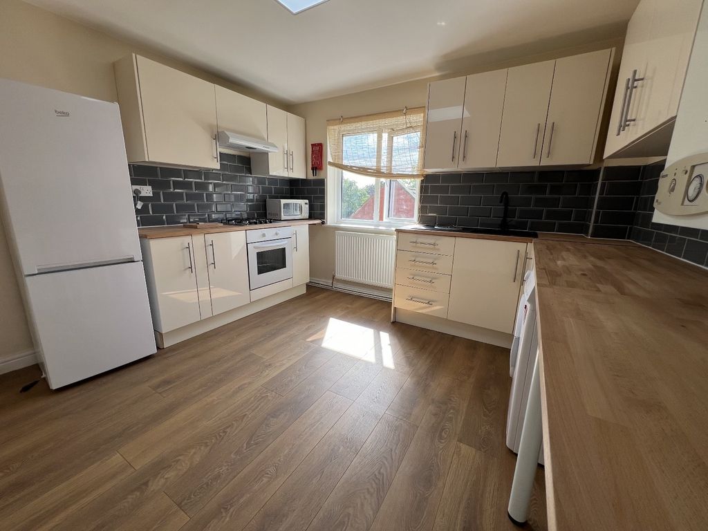 Property photo 2 of 3 Modern, Well-Maintained Kitchen Featuring Ample Na...