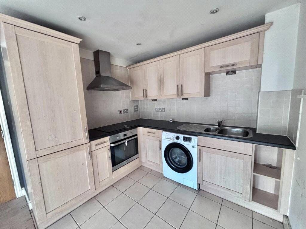 Property photo 3 of 9 Kitchen Area