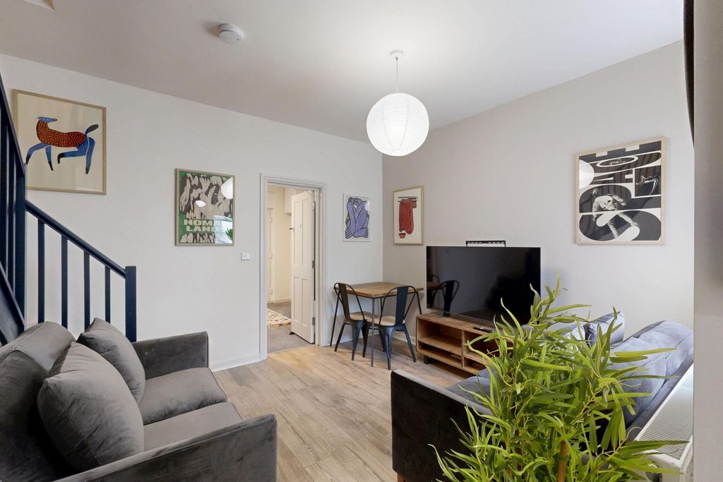 Property photo 1 of 11 Bright And Modern Living Room Featuring A Spacious...