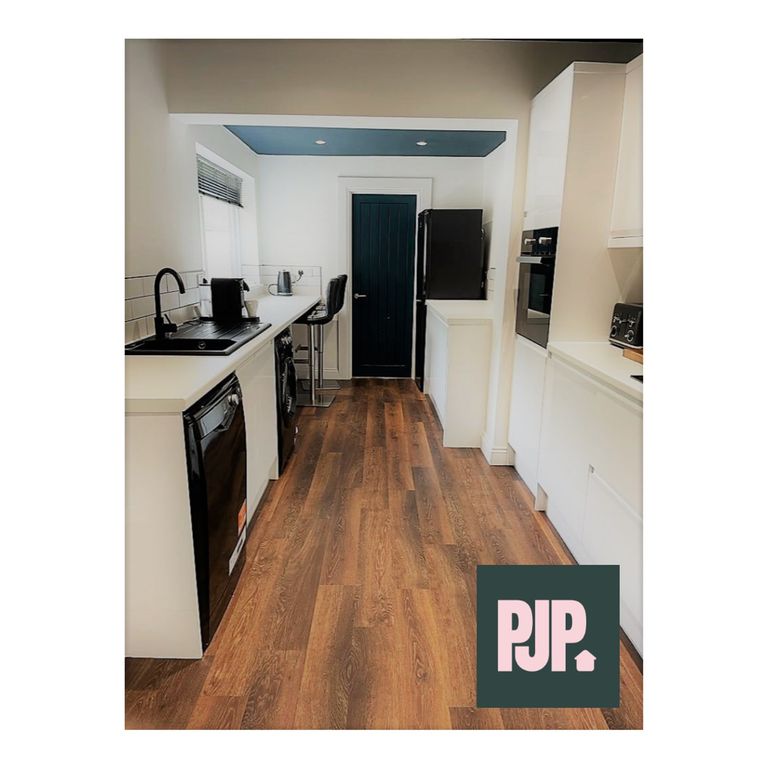 Property photo 3 of 5 A Modern And Spacious Kitchen, Featuring Sleek App...