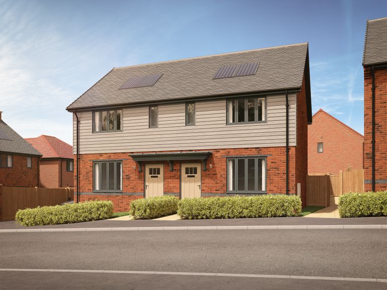 Property 1 of 10. A Row Of Modern Semi-Detached Houses With Manicured Hedges In The Foreground And A Clear Blue Sky In