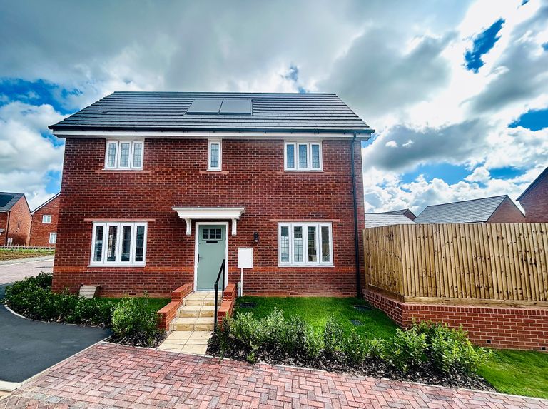 Property 1 of 7. A Modern Red Brick House With A Light Blue Door Stands In The Foreground
