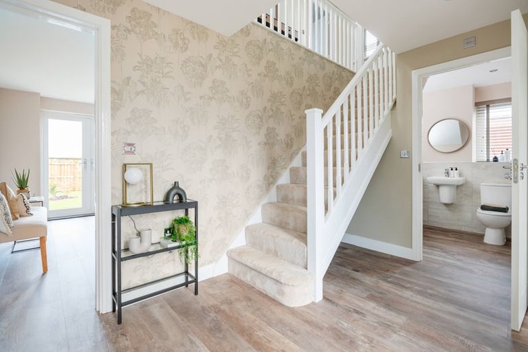 Property 2 of 13. A Welcoming Hallway That Boasts With Natural Light