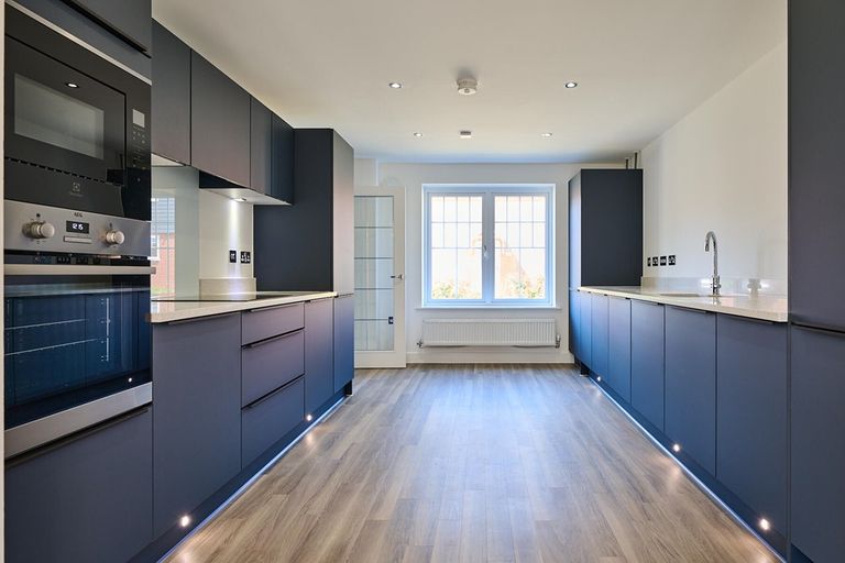 Property 3 of 12. The Kitchen Is A Stylish And Sleek Navy With Fitted Appliances