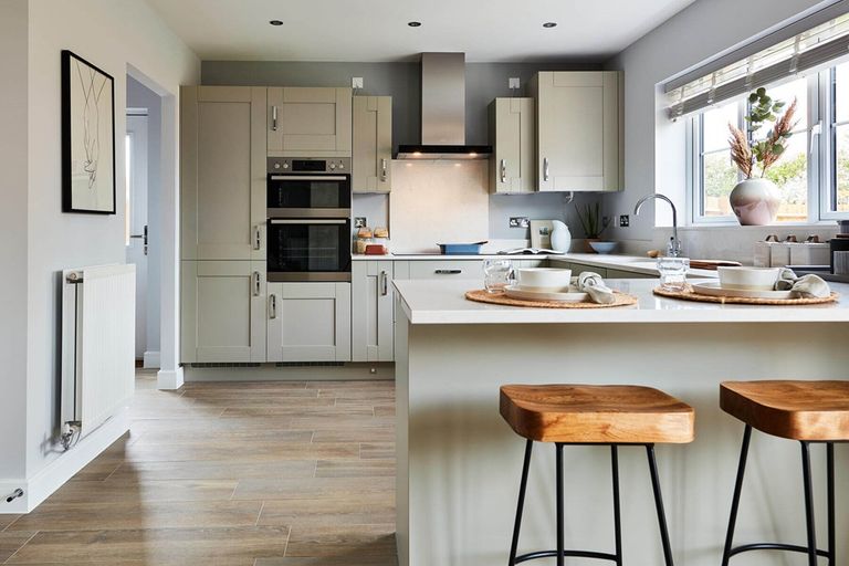 Property 2 of 11. The Kitchen Features A Breakfast Bar, Creating A Sociable Space For The Family