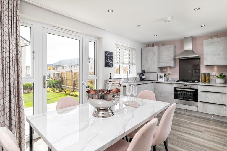Property 2 of 10. Kitchen And Dining Room In Three Bedroom Home