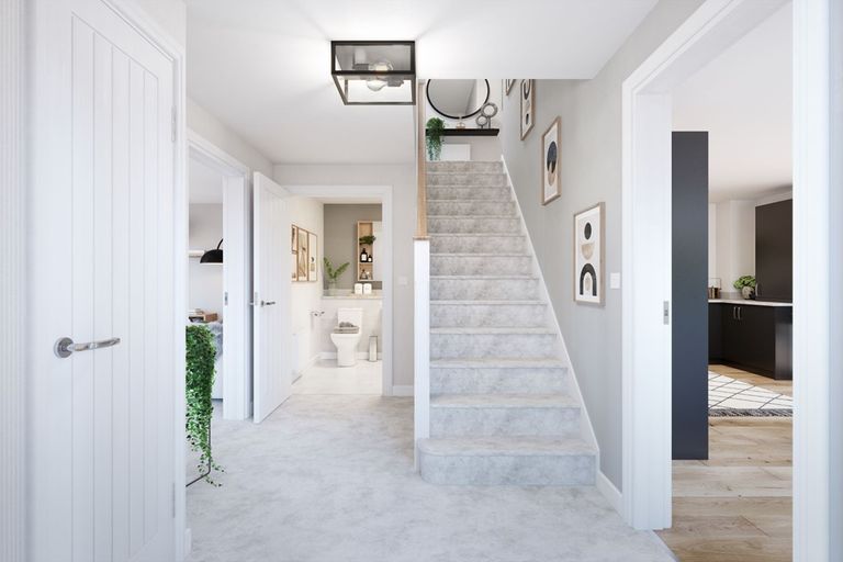 Property 2 of 12. A Welcoming Hallway With A Downstairs Toilet And Storage Space