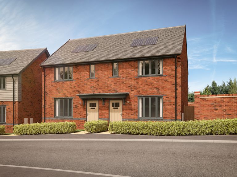 Property 1 of 10. A Row Of Modern Brick Houses With Manicured Hedges In The Foreground Sits Under A Bright Blue Sky Wi