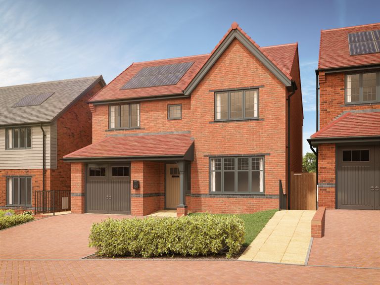 Property 1 of 10. A Modern Brick House With Solar Panels On The Roof Sits Behind A Neatly Trimmed Hedge
