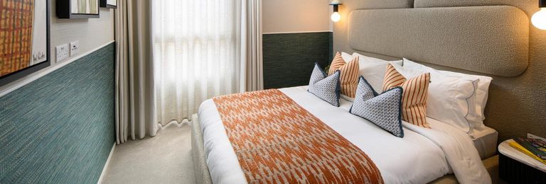 Property 3 of 5. Heron Wharf, Property B1-03-03, Spacious Bedroom With Cosy Lighting