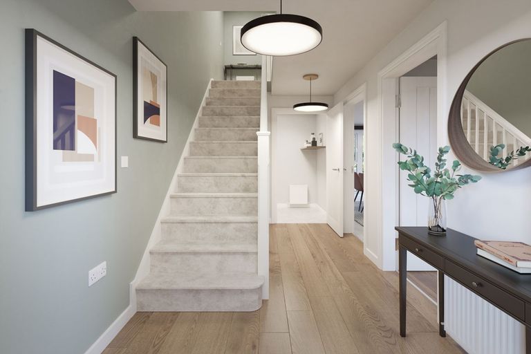 Property 2 of 12. A Welcoming Hallway With Under Stairs Storage