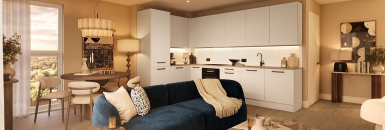 Property 2 of 4. Living Space In Foreground, Kitchenette With White Finishes, Dining Table In Background