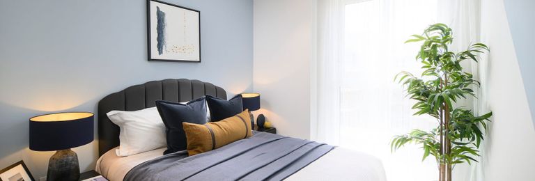 Property 3 of 5. Bedroom With Wall Hanging, Bedside Tables, Blue And White Palette