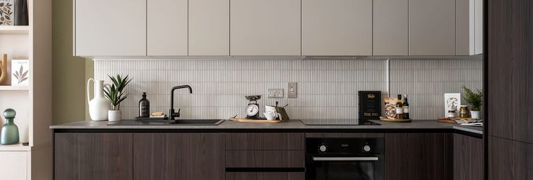 Property 2 of 4. Kitchen Area With White Splashback Tiles And White And Mahogany Brown Cupboards.