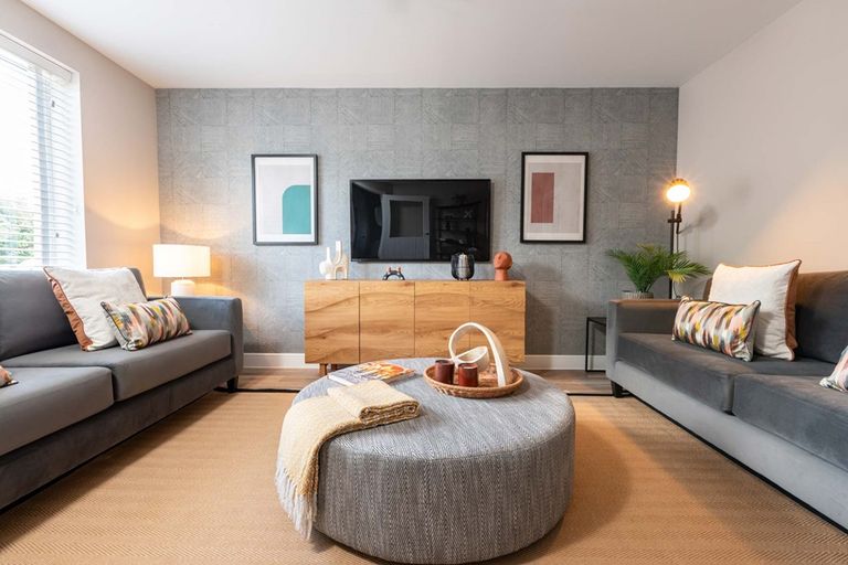 Property 2 of 11. A Cozy Living Room At The Front Of The House Creates A Warm Inviting Space For Your Family.