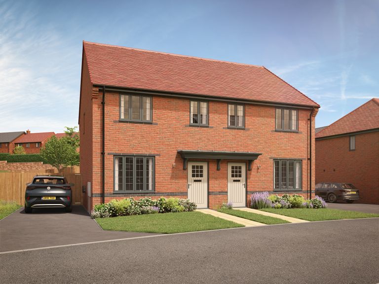 Property 1 of 10. A Modern Red Brick Semi-Detached House With A Car In The Driveway Sits In Front Of A Clear Blue Sky