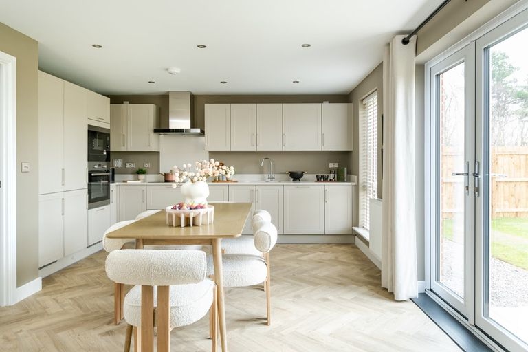 Property 1 of 19. A Modern Kitchen And Dining Area With Ample Storage Space
