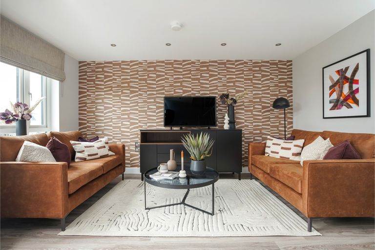 Property 1 of 12. A Spacious And Inviting Lounge With Large Windows That Allow Plenty Of Natural Light To Flood The R