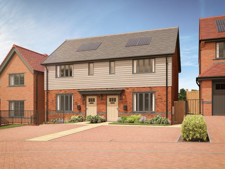 Property 1 of 10. A Pair Of Modern Semi-Detached Houses With Light-Colored Siding And Brick Bases Are Fronted By A Pav