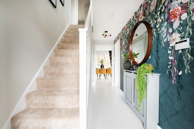 Property 2 of 15. The Hallway Is Welcoming And Includes Under Stairs Storage