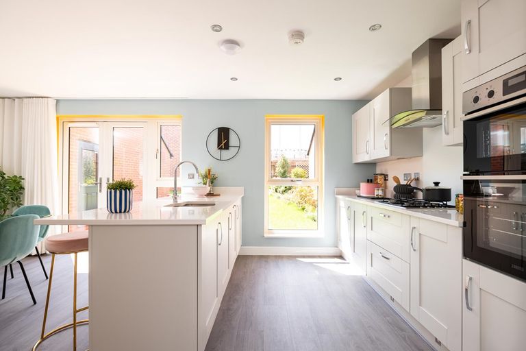 Property 2 of 13. Modern Kitchen With Ample Storage Space And Sociable Breakfast Bar