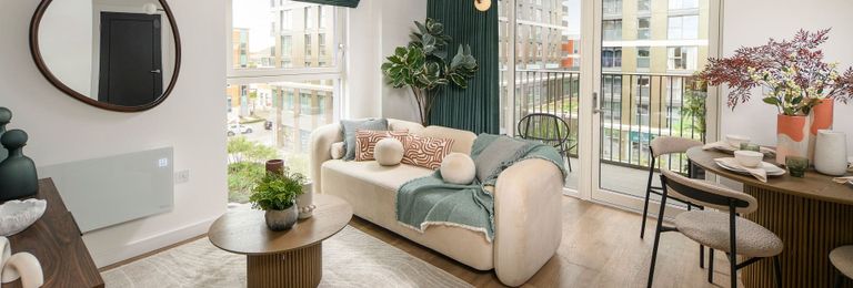 Property 1 of 5. Decorated Living-Dining Area With Ample Natural Lighting From Windows And Balcony Doors