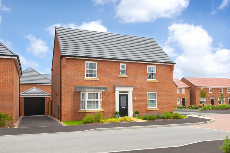 Property 2 of 9. External View Of The Four Bedroom Layton Home