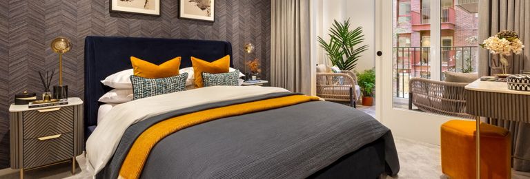 Property 3 of 5. Double Bed With Modern Black And Orange Design Décor, Balcony Doors And Vanity Table.