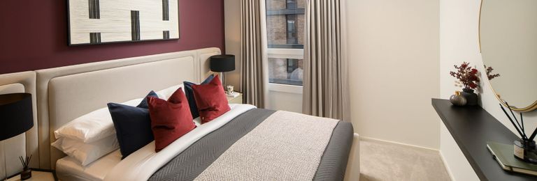 Property 3 of 5. Double Bed With Contemporary Design, Bedside Tables And Wall Hanging And Wall Mirror.